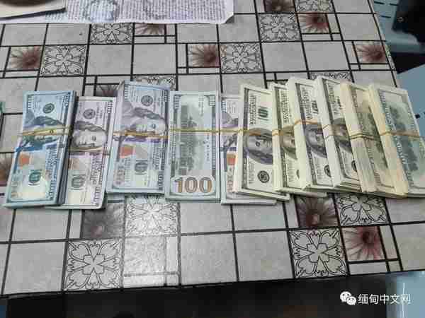 缅甸货币兑换店，两名外国人上演“狸猫换太子”，10万美金真变假